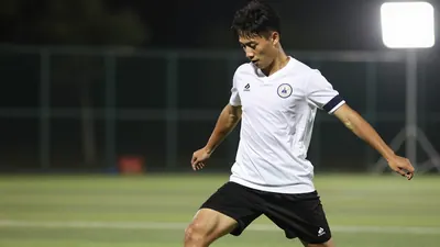 A photorealistic image of a 20-year-old anonymous left-back with a clean white jersey and black shorts, playing a...
